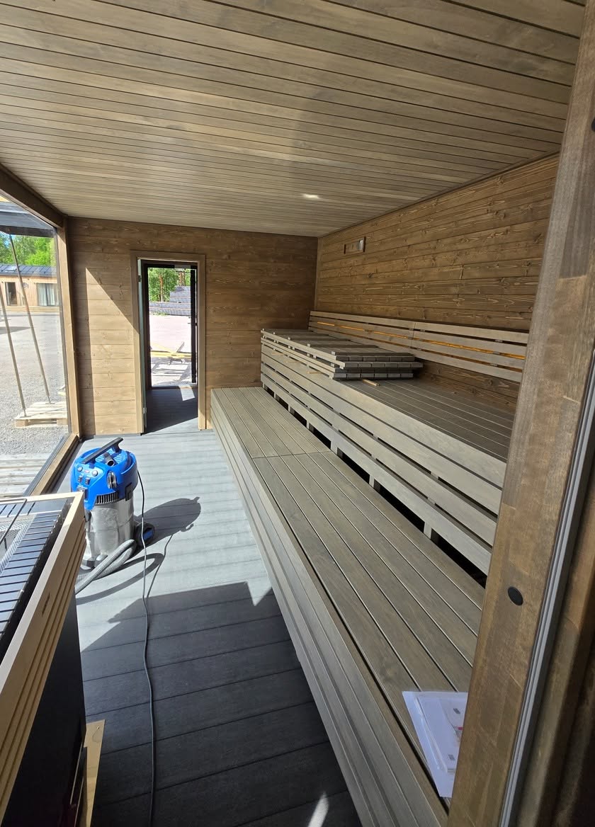 Long wooden sauna benches ready for guests